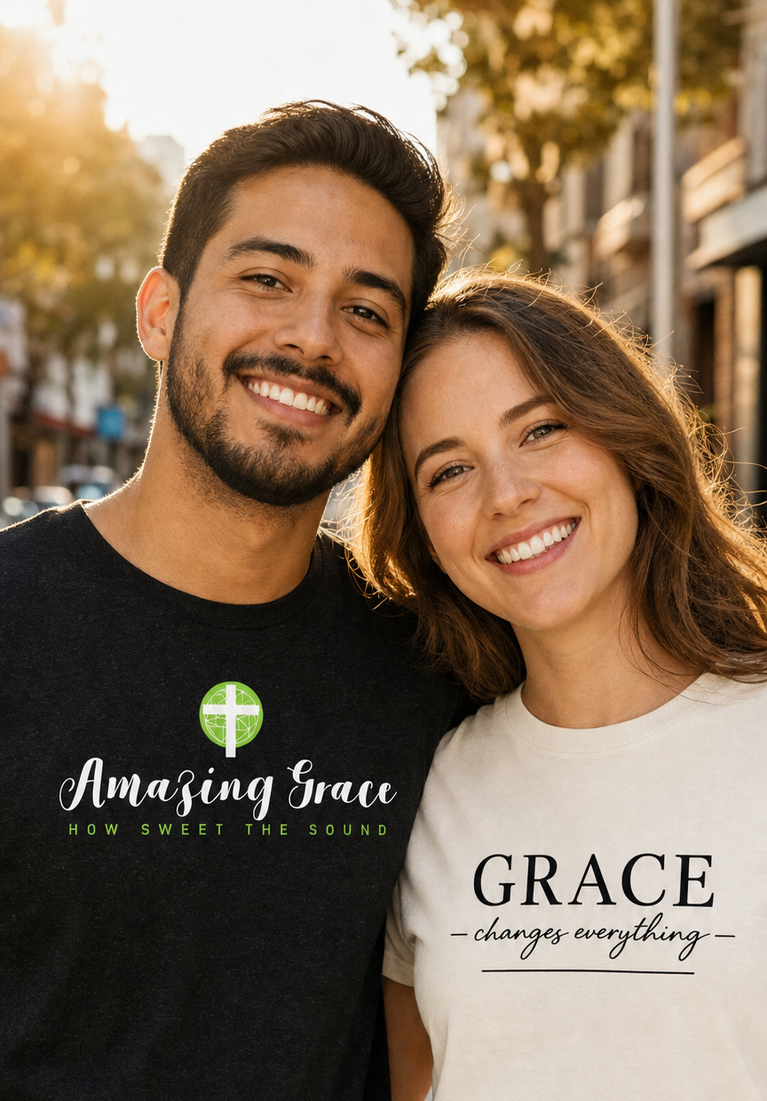 Two people wearing FaithBase tees on a city street at golden hour